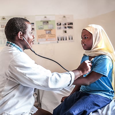 Doctor examining child