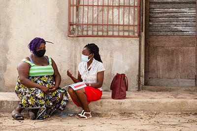 Health worker visits patient at home